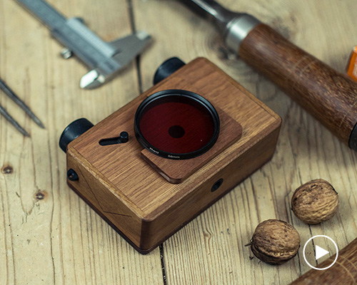 a wooden camera with no lens, no mirror and no batteries