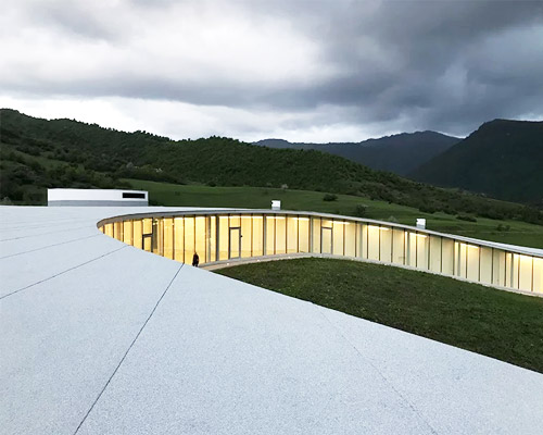 kaloustian's 'smart center' embraces the landscape of armenia in smooth, organic form
