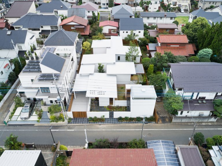 ikawaya architects' seven gardens house is arranged in a checkered pattern