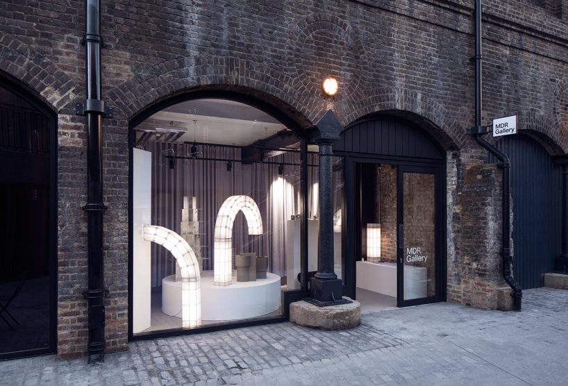 studio mieke meijer decks london's coal drops yard with giant sculptural lights