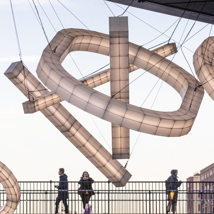 studio mieke meijer decks london's coal drops yard with giant sculptural lights