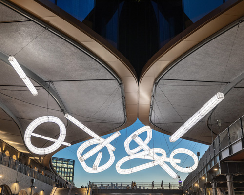 studio mieke meijer decks london's coal drops yard with giant sculptural lights