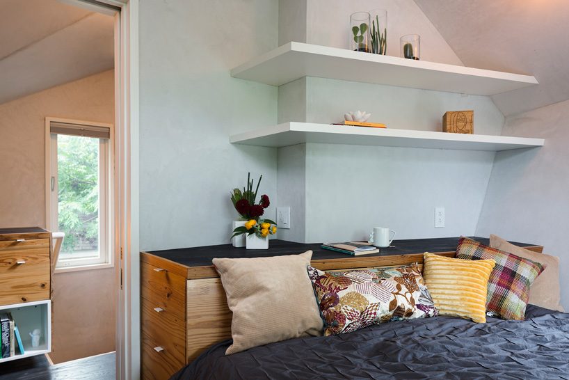 studio 512 clads the angled walls of this texas guesthouse in reclaimed cedar shakes