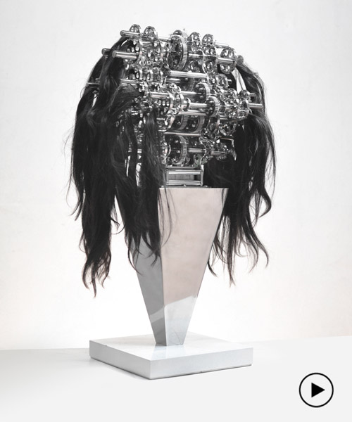 kinetic machine with hair caught in it explores the chaos and anxiety of our reality