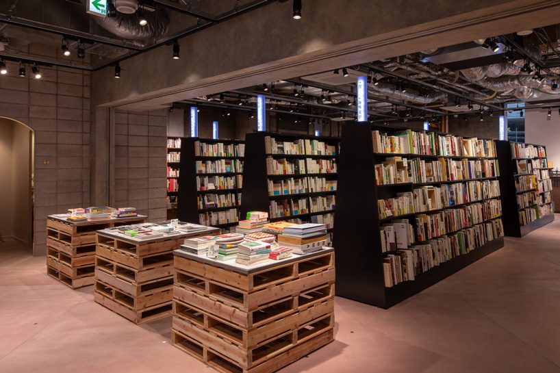 bunkitsu bookstore in tokyo charges a fee to access its curated collection books & magazines
