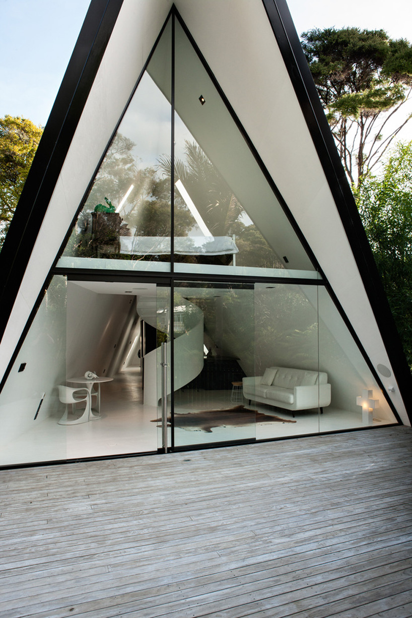 chris tate completes tent-shaped weekend house in new zealand rain forest