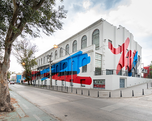 elian chali's vibrant mural transforms a waterfront heritage building in argentina