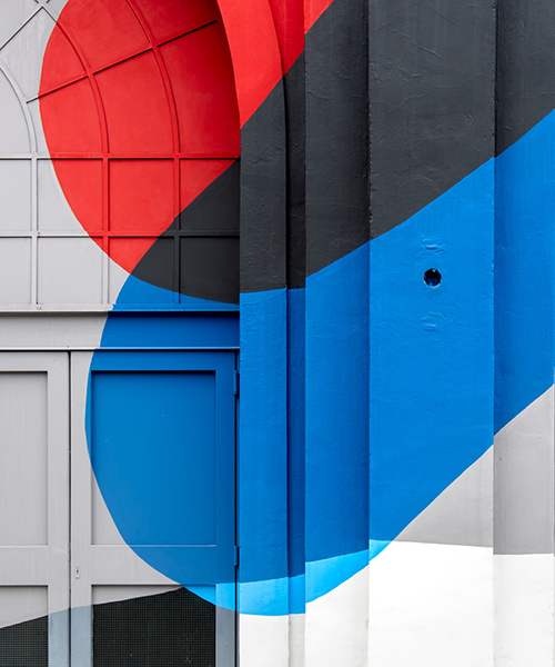 elian chali's vibrant mural transforms a waterfront heritage building in argentina