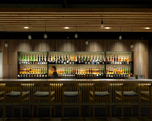 imafuku architects renovates beijing's old building into a japanese izakaya pub