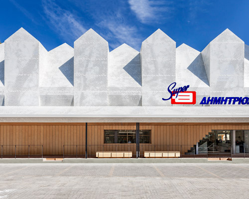 klab architecture's supermarket in athens features a set of gabled roofs