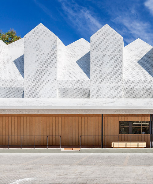 klab architecture's supermarket in athens features a set of gabled roofs