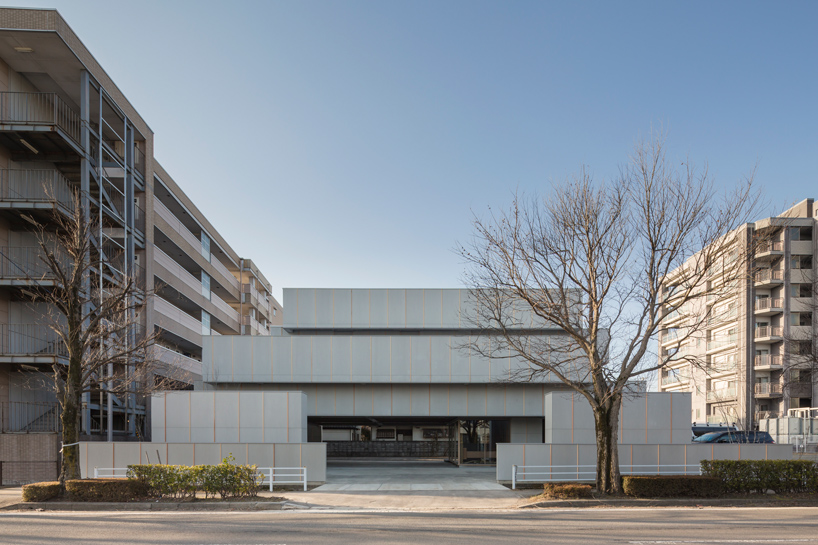 life style koubou completes windowless concrete house with sunny interiors