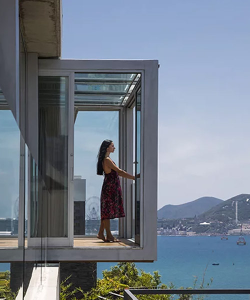 MM++ architects' villa in vietnam uses retractable glass loggia for unique ocean view