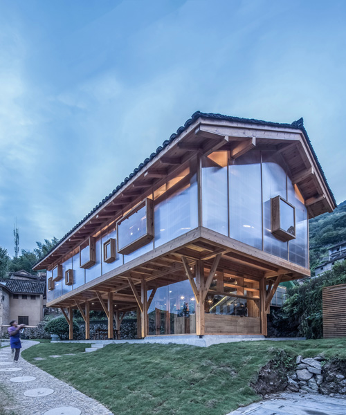 suspended wooden book house is clad in translucent panels by shulin architectural design