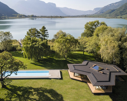 architects extend a modernist hotel with a transparent spa pavilion in south tyrol