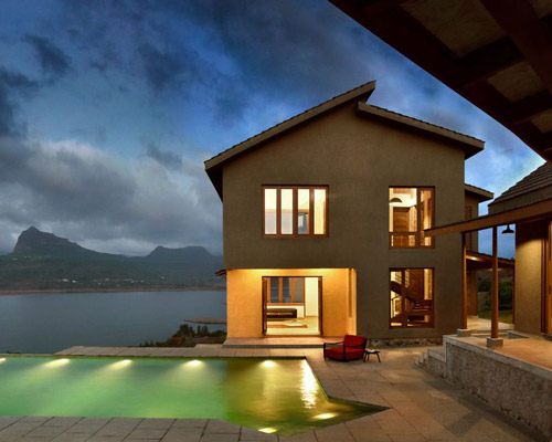 studio PKA builds '5 element house' to the contours of the land in india