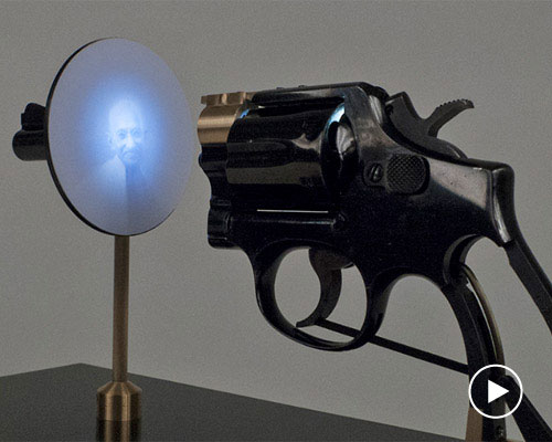 artist constantine zlatev transforms a revolver into a slide projector in tribute to nonviolent resistance
