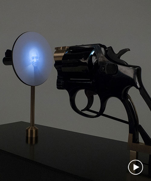 artist constantine zlatev transforms a revolver into a slide projector in tribute to nonviolent resistance
