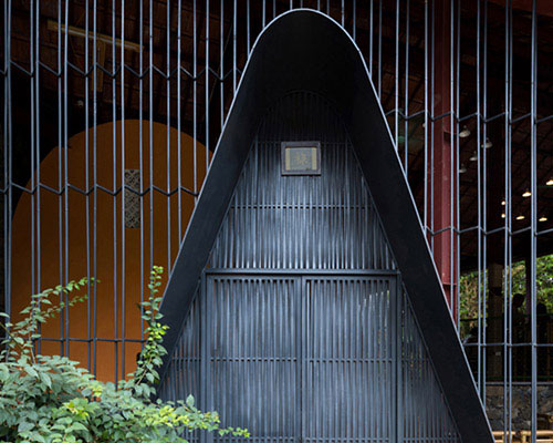 this restaurant in vietnam is fenced by translucent steel lattice