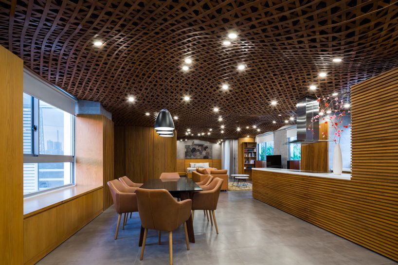 CTA tops vietnam apartment with 'cloud' of interlaced wood on its ceiling