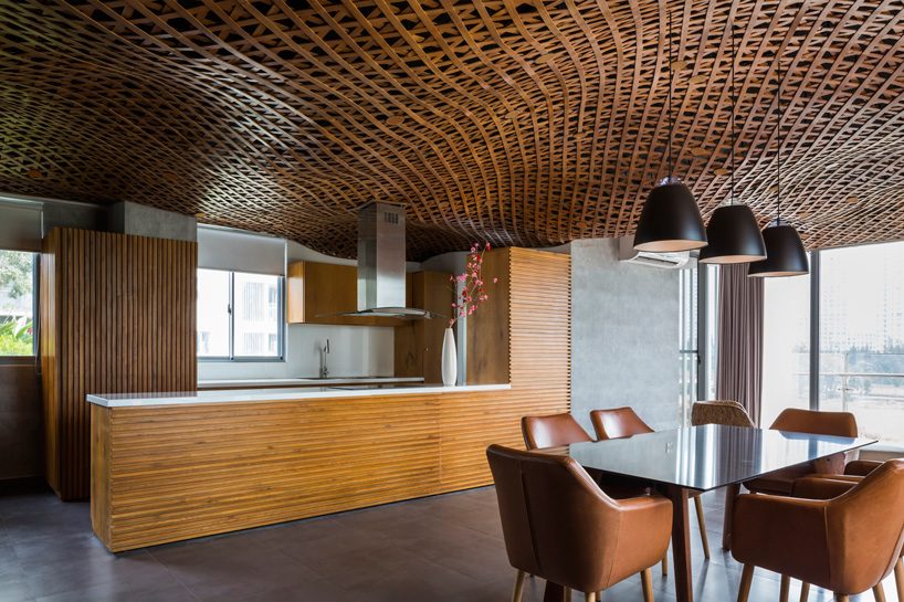 CTA tops vietnam apartment with 'cloud' of interlaced wood on its ceiling