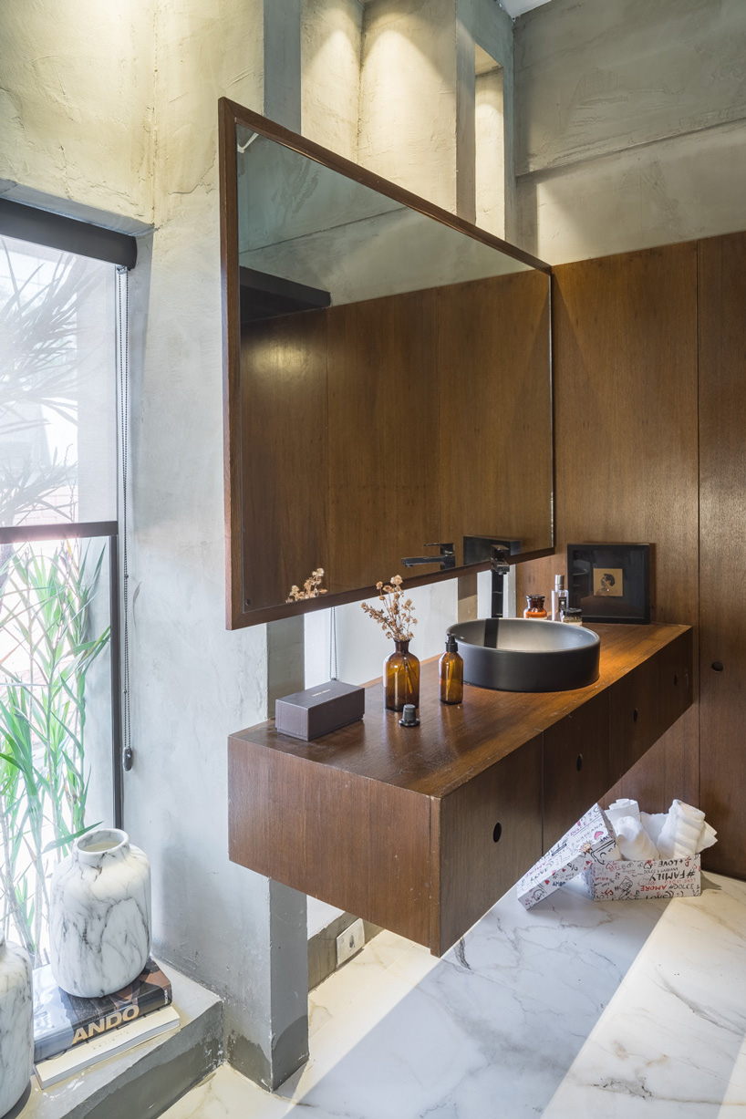 debaixo do bloco transforms part of an oscar niemeyer building into 68 sqm apartment