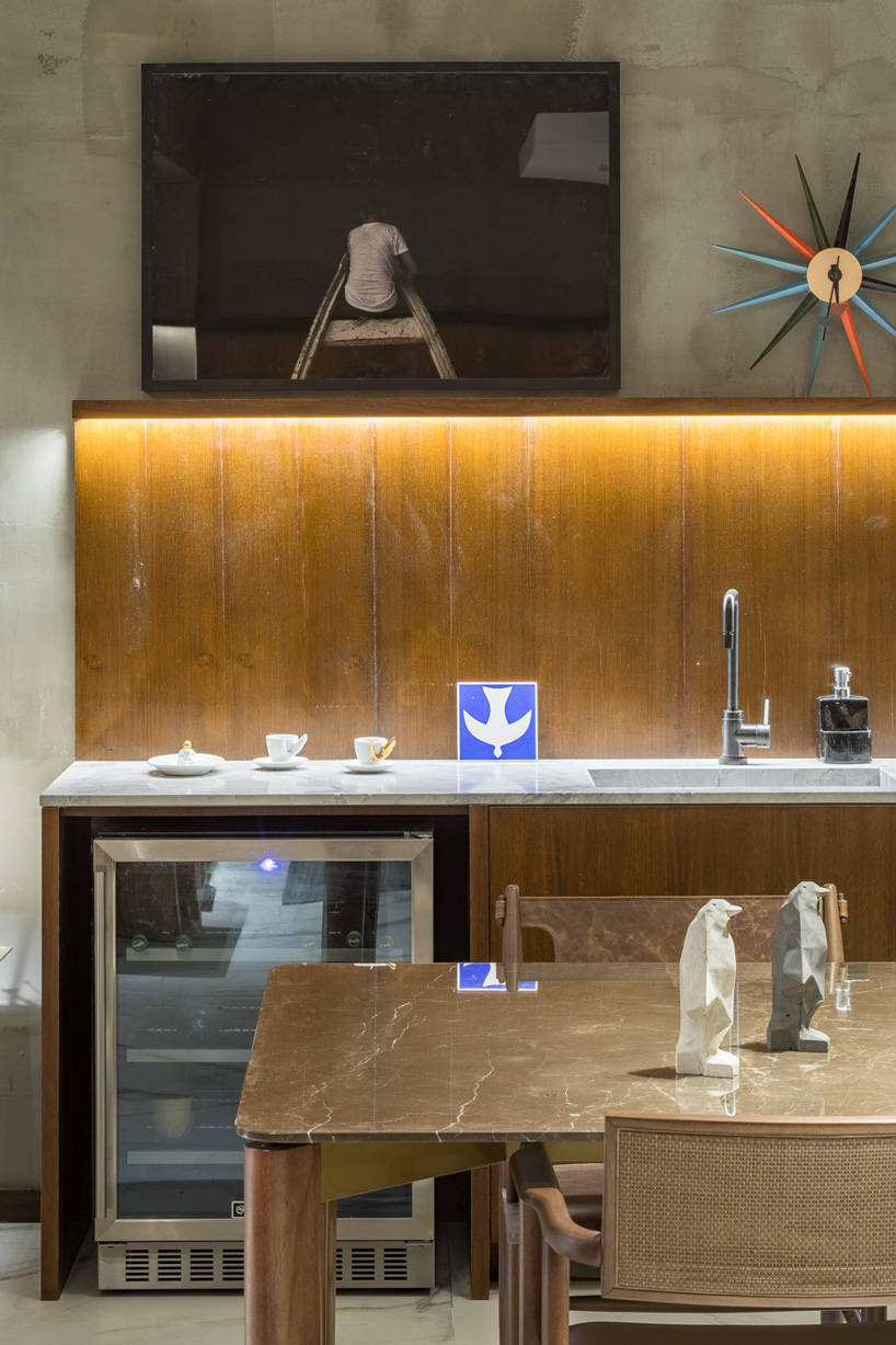 debaixo do bloco transforms part of an oscar niemeyer building into 68 sqm apartment