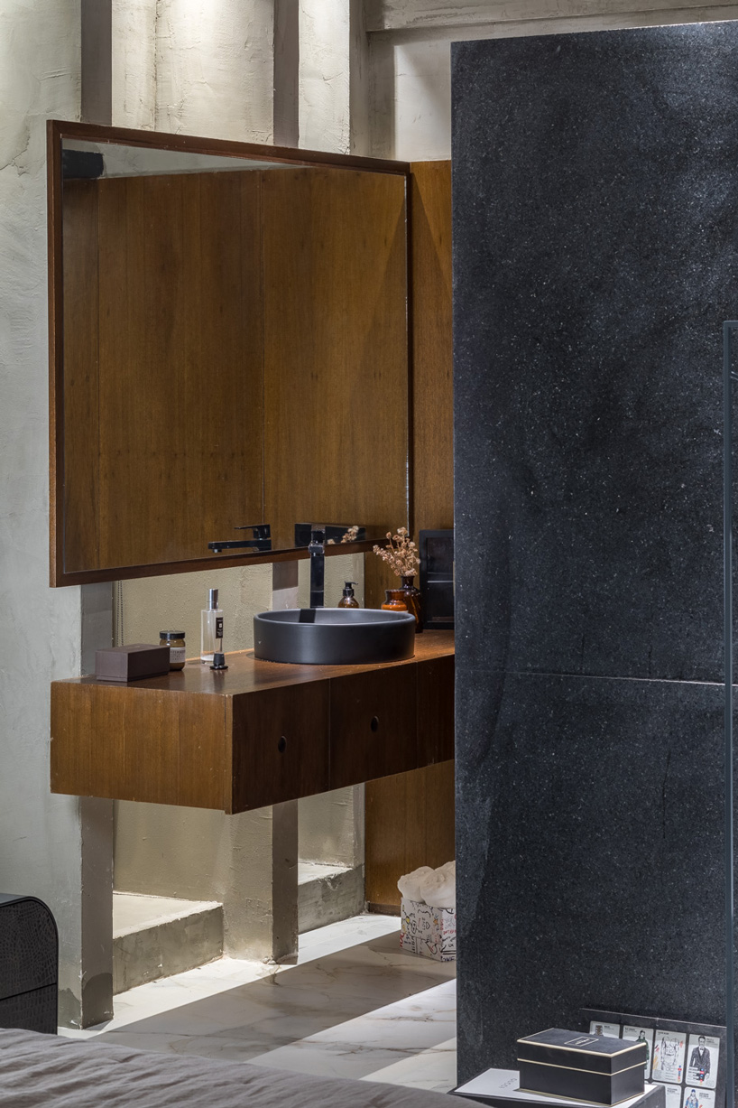 debaixo do bloco transforms part of an oscar niemeyer building into 68 sqm apartment