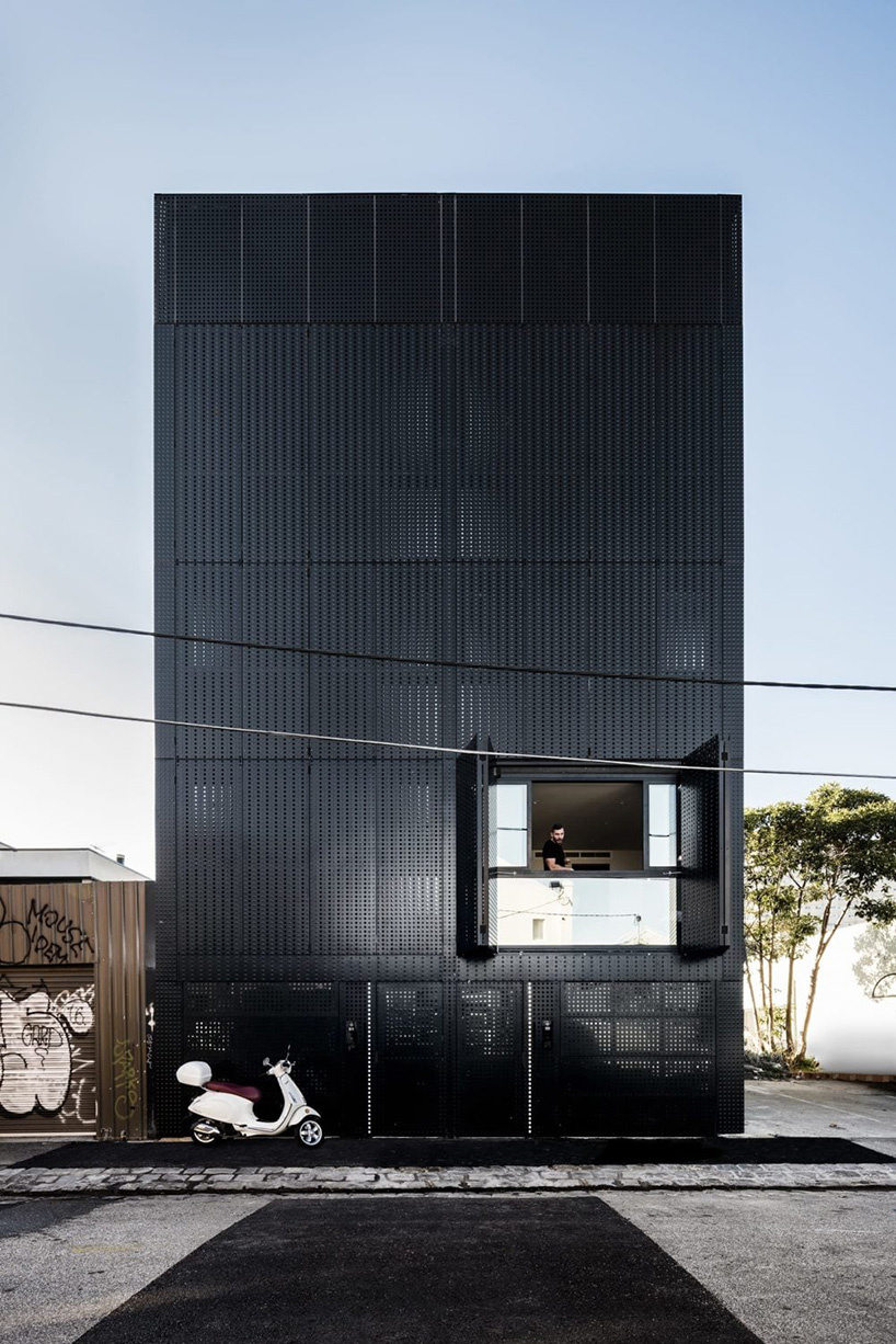 DKO + SLAB add black metal screen façade to vertical dwellings in australia