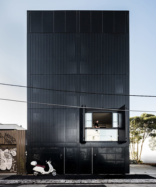 DKO + SLAB add black metal screen façade to vertical dwellings in australia
