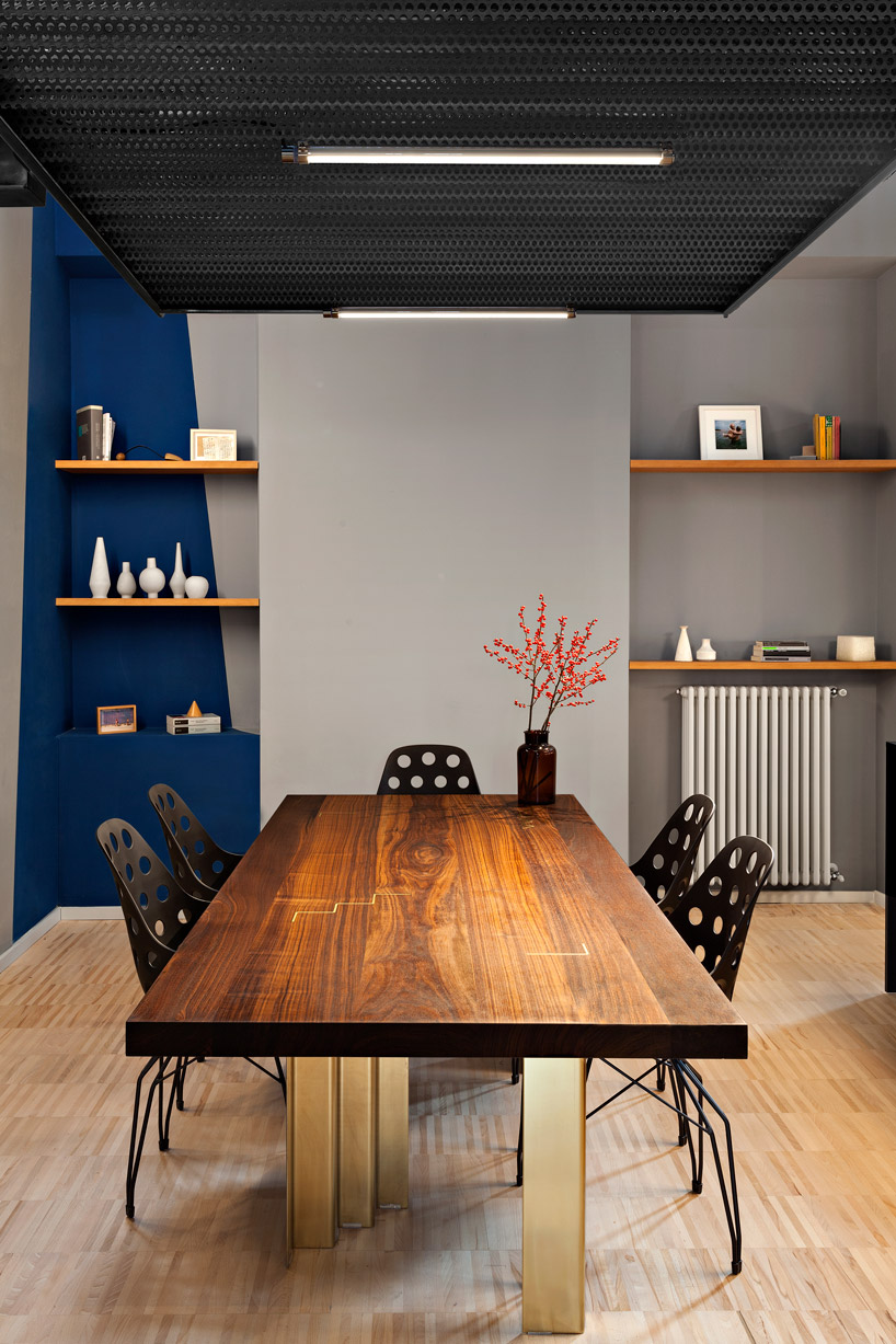 DVDV studio architects completes 'blue and concrete' apartment in milan