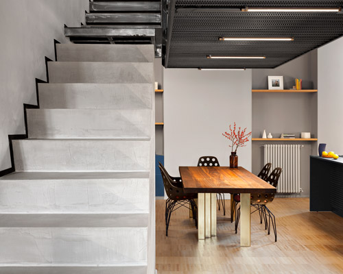 DVDV studio architects completes 'blue and concrete' apartment in milan