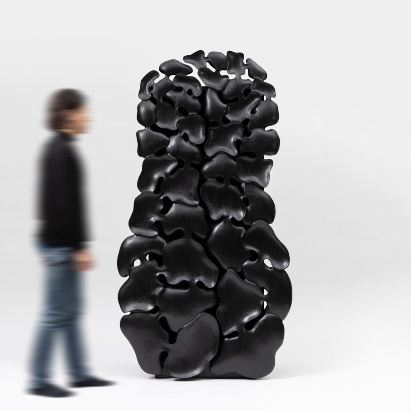 kim yun-hwan composes furniture pieces using hand-carved wooden shapes