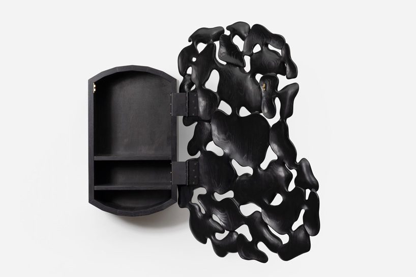 kim yun-hwan composes furniture pieces using hand-carved wooden shapes