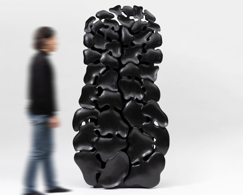 kim yun-hwan composes furniture pieces using hand-carved wooden shapes