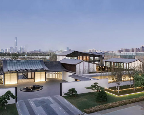 lacime architects reflects the suzhou leisure center in pools of water in china