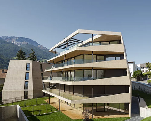 marx ladurner forms two concrete masses for residential complex in italy