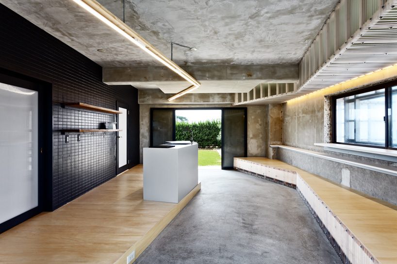 nanometer architecture wraps japanese seaside villa in corrugated polycarbonate panels