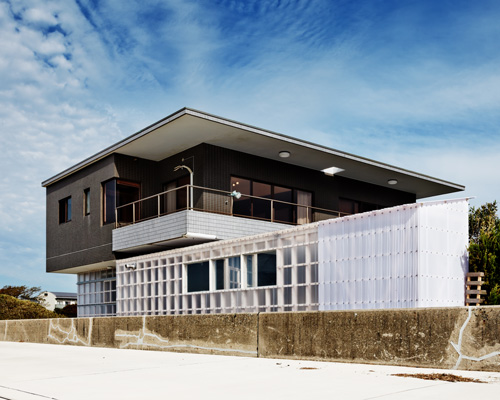 nanometer architecture wraps japanese seaside villa in corrugated polycarbonate panels