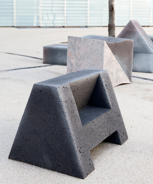 olivier vadrot's lava stone and marble seats are shaped like latin alphabet letters