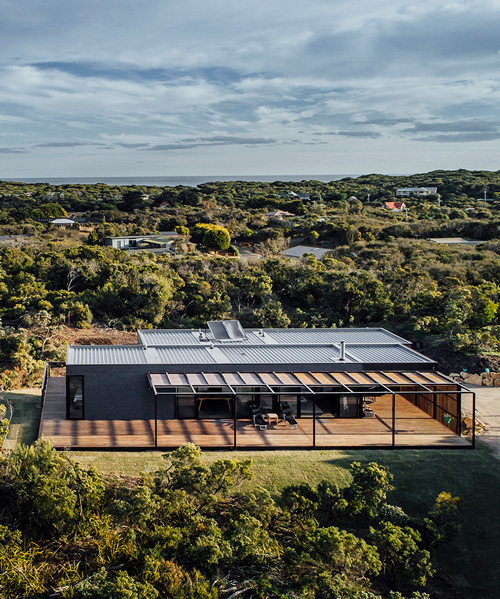 prefab st. andrews beach house by prebuilt is nestled between the sand dunes of victoria
