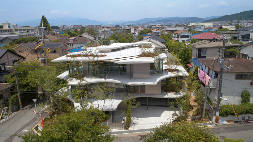 tomohiro hata constructs the 'ground house' in response to the density of osaka