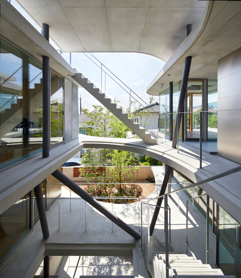 tomohiro hata constructs the 'ground house' in response to the density of osaka