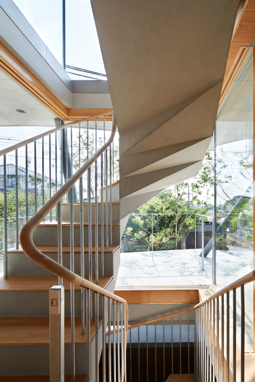 tomohiro hata constructs the 'ground house' in response to the density of osaka