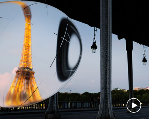 vincent leroy distorts reality with giant suspended bubble installation in paris