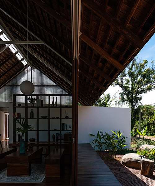 YT house by studio rear connects indoor spaces with the nature of vietnam