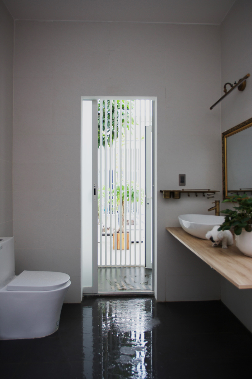 U-shaped residence by atelier NgNg references traditional vietnamese garden houses