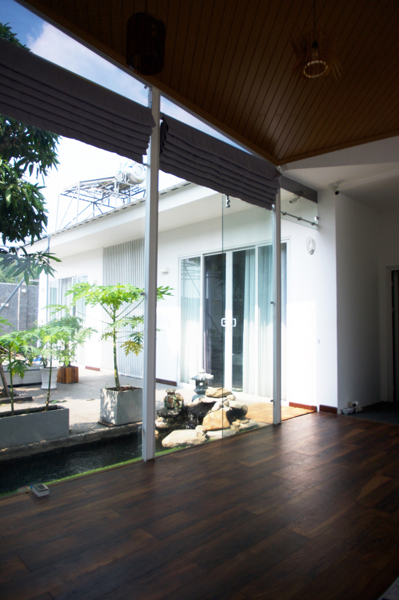 U-shaped residence by atelier NgNg references traditional vietnamese garden houses