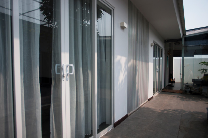 U-shaped residence by atelier NgNg references traditional vietnamese garden houses