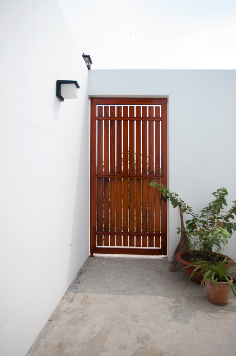 U-shaped residence by atelier NgNg references traditional vietnamese garden houses